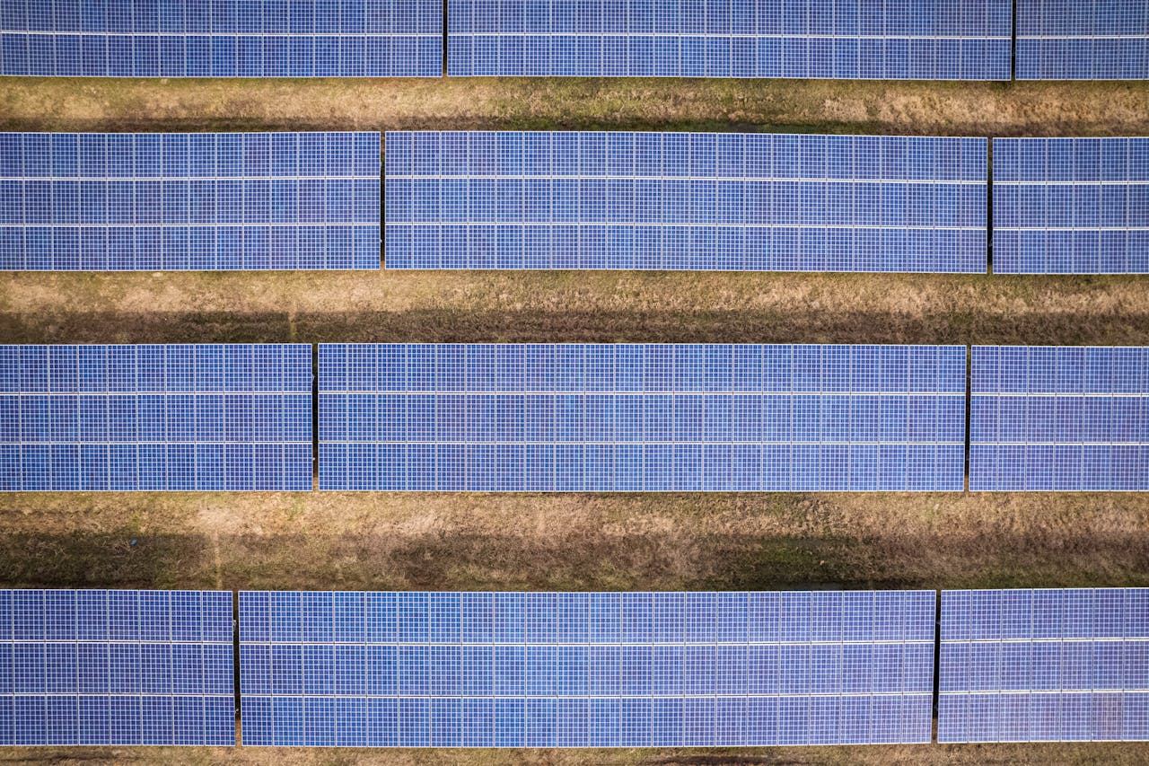 our-story Aerial shot of solar panels arranged in a field in Rocky Mount, NC.